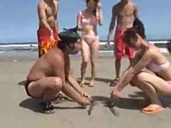 Japanese girls wrestling on the beach