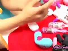 2 Asian Girls Stimulating Nipples And Pussies With Various Toys On The Carpet In The Room